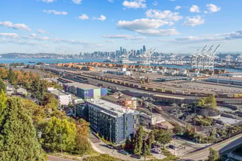 an aerial view of the port with the city in the background