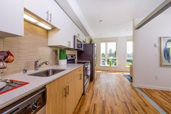 Bright living room at Lillehammer Apartments, Seattle, WA; contemporary finishes and ample natural light.