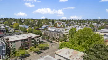 an aerial view of a city with buildings and trees