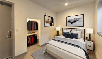 a bedroom with a bed and a closet