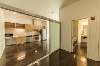 Bright living room at Vibe Apartments Seattle rental, contemporary decor, ample natural light.