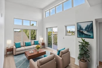 a living room with couches and a coffee table
