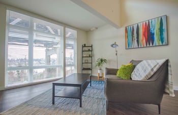 Larson Building apartment in Seattle, WA - bright living area with modern finishes and large windows