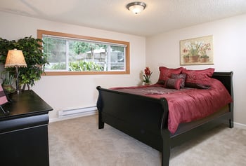 Bright living room at Hill Crest Apartments in Tukwila, WA; rental-ready space with large window.