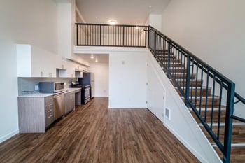 Loft-style living area with modern design and hardwood flooring