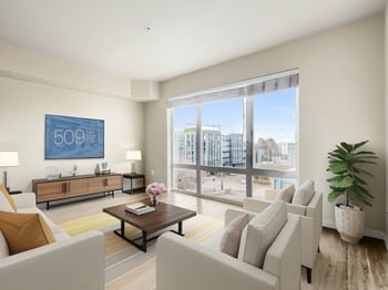 Interior view of a rental apartment at 509 1st Ave, Seattle, WA 98104: bright living room with hardwood floors and window.