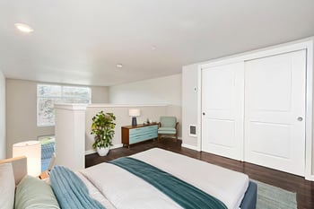 Ludwig Apartments, Seattle: bright living room with large window and modern finishes; rental photo.