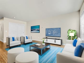 Bright living room in rental apartment at 509 1st Ave, Seattle, WA; modern sofa, coffee table, and large window.
