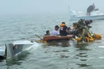 Mexican Navy aircraft crash site in Galveston Bay with Coast Guard rescue boats and emergency responders