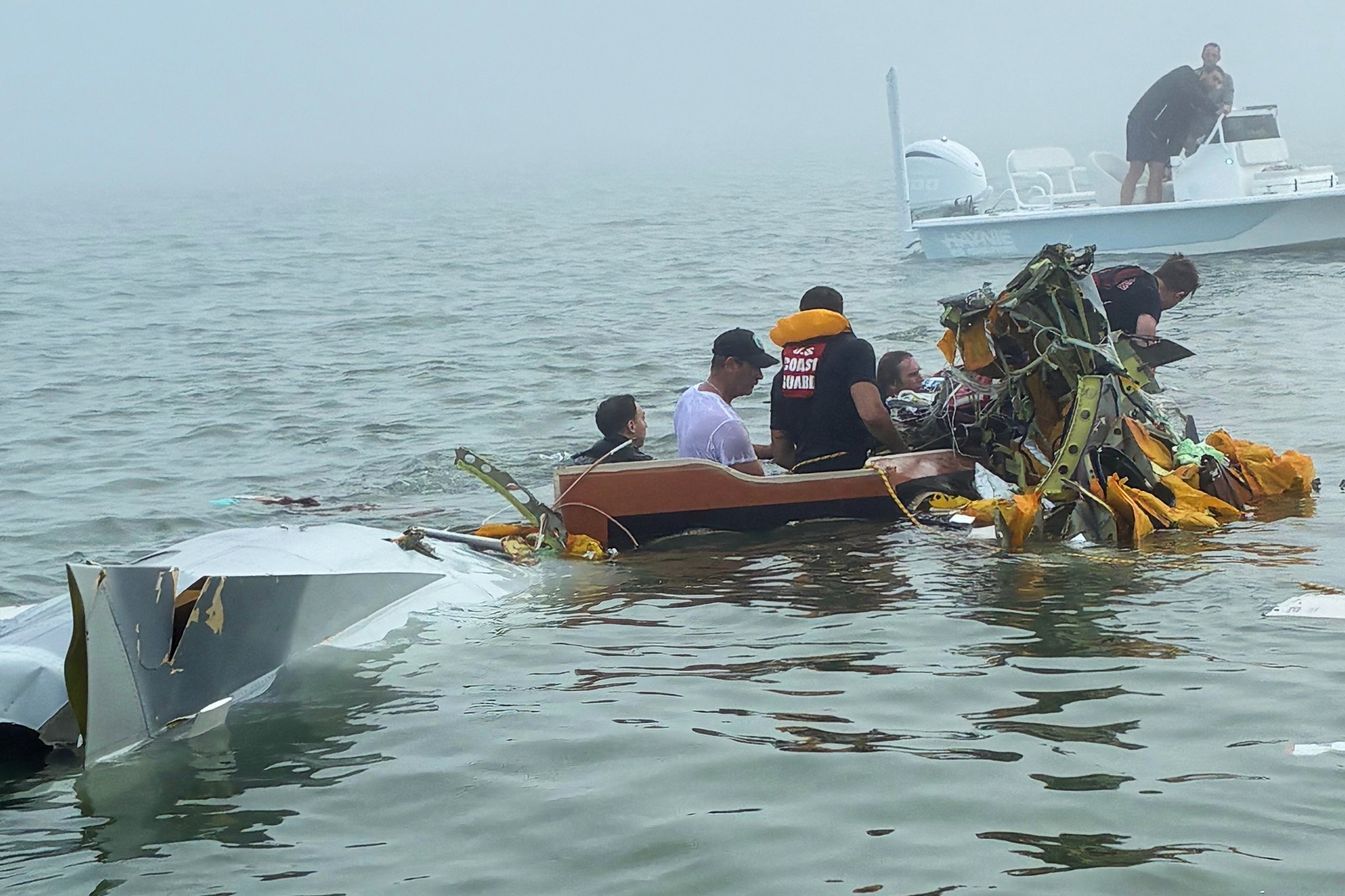Mexican Navy aircraft crash site in Galveston Bay with Coast Guard rescue boats and emergency responders