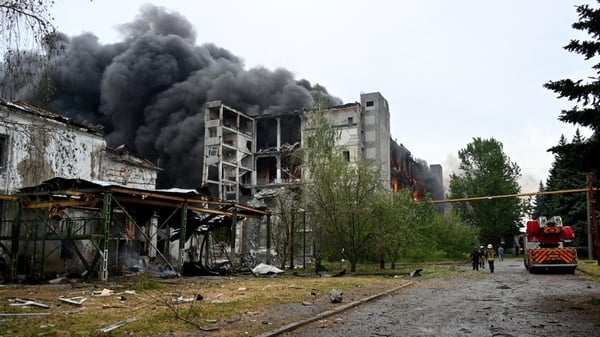 Smoke rises from Russian drone strike rubble in Kharkiv Ukraine day 1383 war casualties