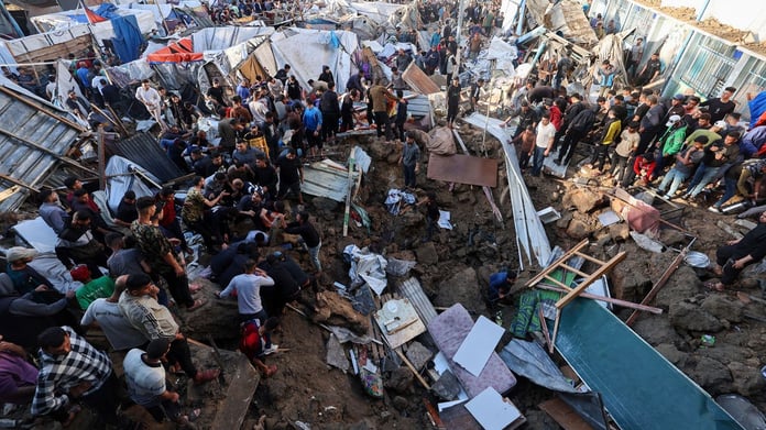 Aftermath of Israeli strike in Gaza City where a paramedic and civilians were killed near displacement tents.