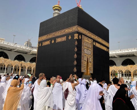 Jeffrey Epstein and UAE billionaire Sultan Ahmed bin Sulayem stand over a sacred Kaaba Kiswa tapestry laid on the floor of Epstein's New York townhouse in 2014