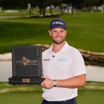 Wyndham Clark celebrates with the CJ Cup Byron Nelson trophy after shooting 60 at TPC Craig Ranch