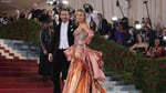Blake Lively arrives at the 2026 Met Gala in a pastel archival Versace gown with a 13-foot train