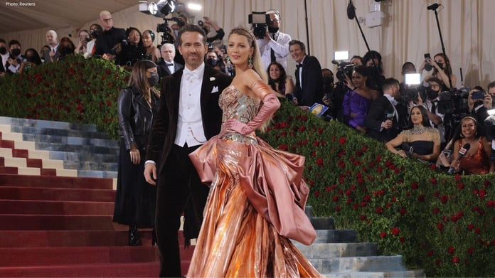 Blake Lively arrives at the 2026 Met Gala in a pastel archival Versace gown with a 13-foot train