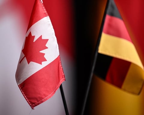 Canadian and German flags at a press conference marking the Ksi Lisims LNG deal with SEFE in 2026