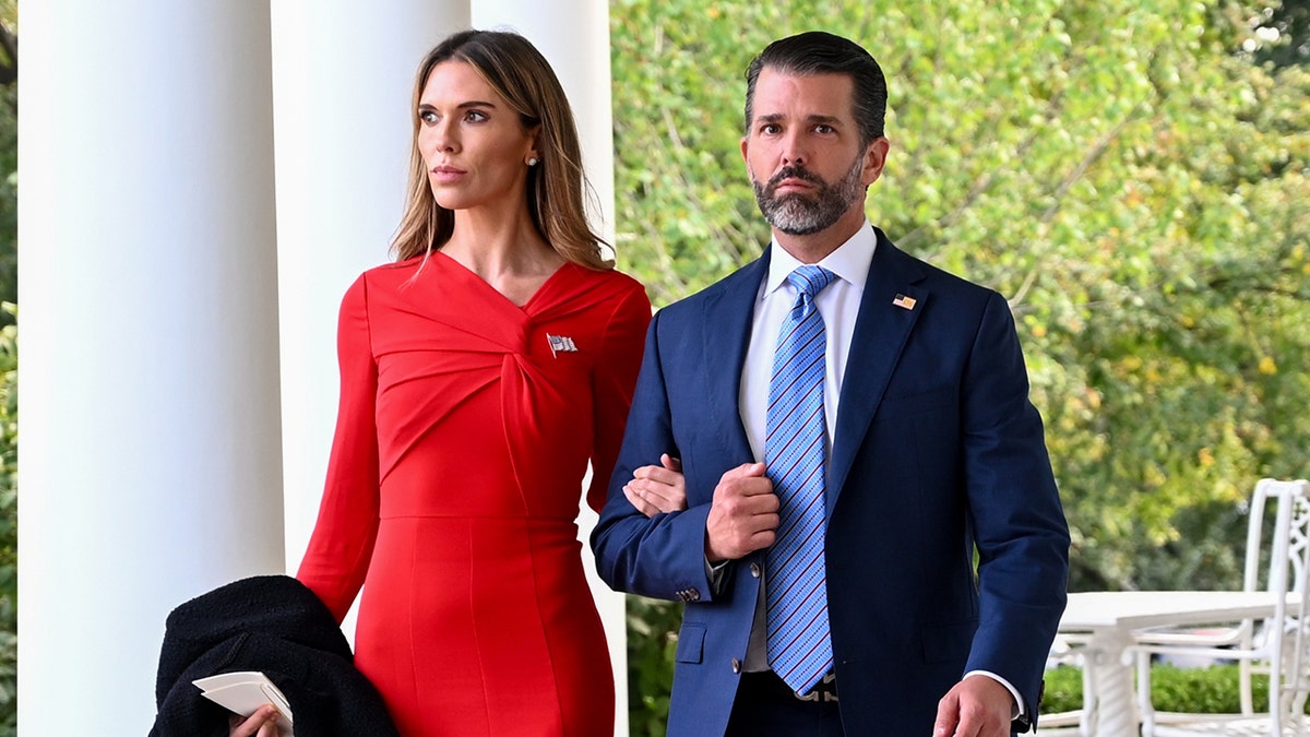 Donald Trump Jr. and Bettina Anderson arrive at the White House Rose Garden in October 2025