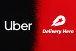 Uber and Delivery Hero logos during takeover battle over Europe and Gulf food delivery markets