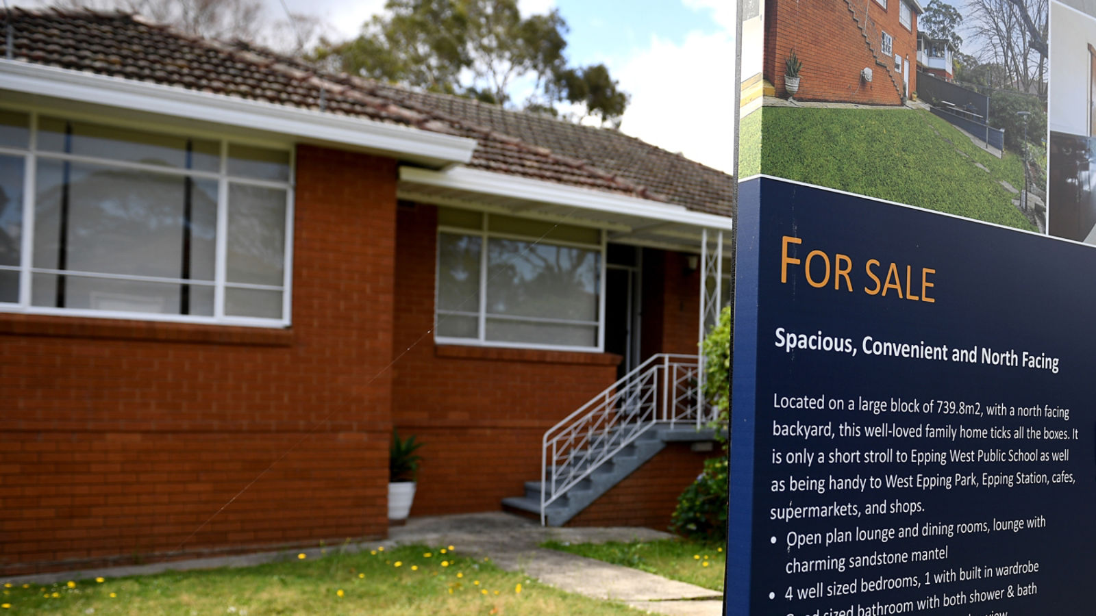 A house for sale sign outside a brick home, illustrating Australia's capital gains tax and negative gearing debate