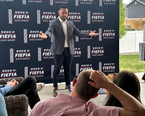 Utah Rep. Doug Fiefia speaks to voters at a backyard gathering in Riverton as he campaigns for Senate District 18