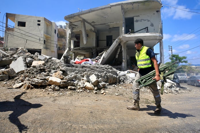 Rescue workers at the scene of an Israeli airstrike in southern Lebanon June 2026