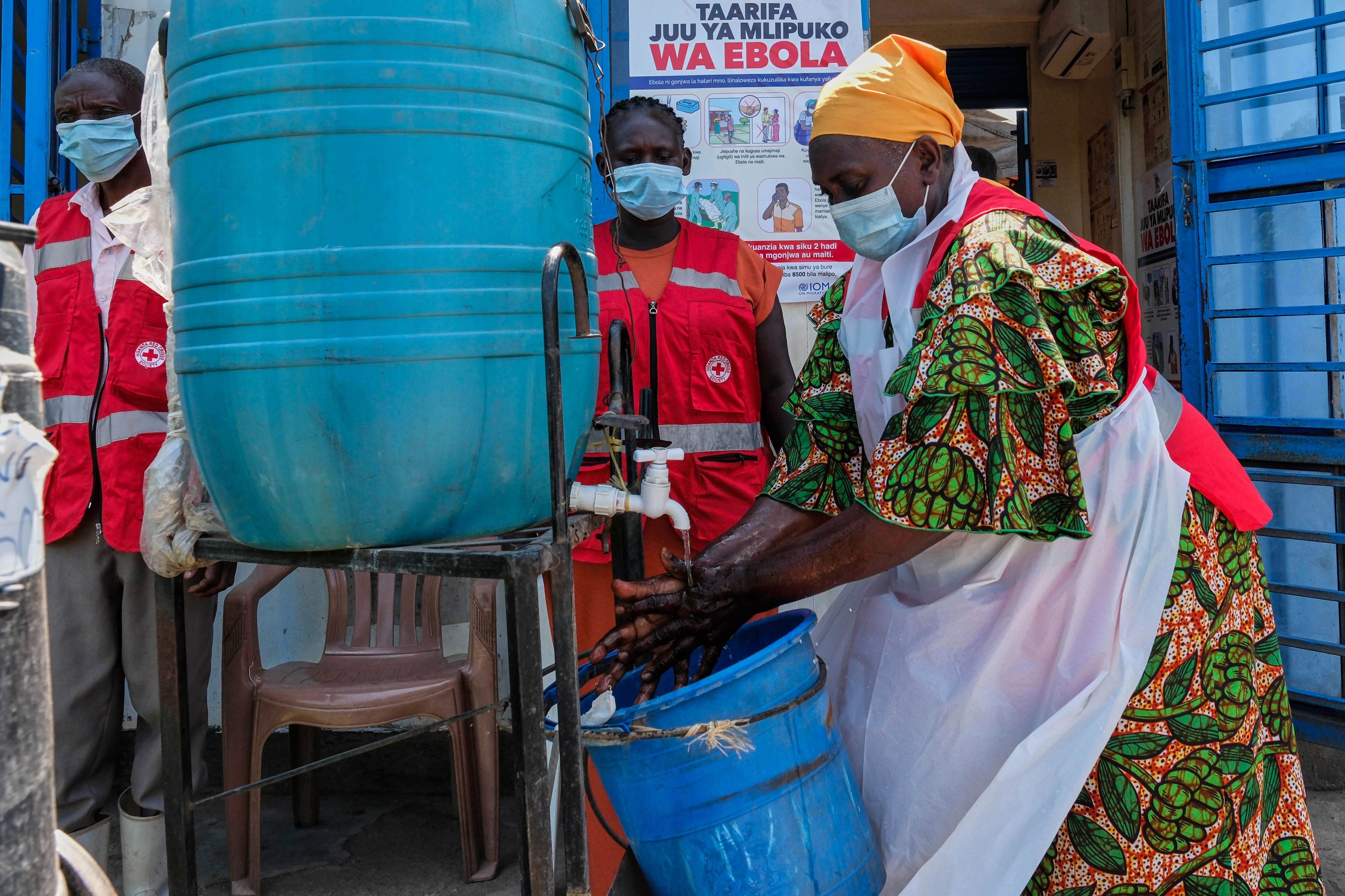 Health worker washes hands at Mpondwe border crossing between Uganda and DRC during 2026 Ebola outbreak