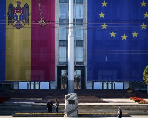 Moldova and EU flags draped on the government building in Chisinau, September 2025
