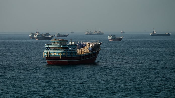 Cargo ships pass through the Strait of Hormuz as Iran-US tensions reshape Gulf shipping routes