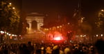 PSG fans gather on the Champs-Elysees in Paris after Champions League win over Arsenal in Budapest