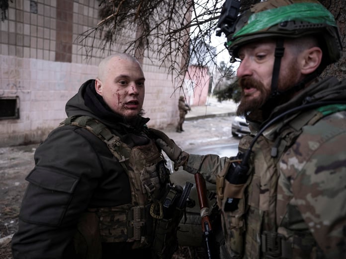 Ukrainian soldier assists injured comrade during medical evacuation Druzhkivka Donetsk region February 2026
