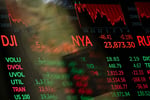 Digital screens displaying trading numbers on the New York Stock Exchange trading floor during the Nasdaq chip stock selloff