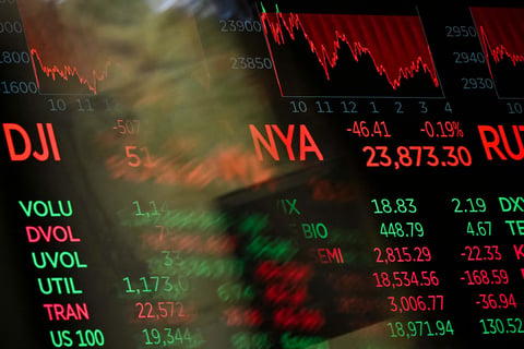 Digital screens displaying trading numbers on the New York Stock Exchange trading floor during the Nasdaq chip stock selloff