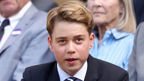 Prince George smiles in a portrait photograph taken at Kensington Palace for his 13th birthday
