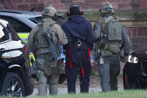 Police escort Serhii Kuznietsov Ukrainian Nord Stream pipeline sabotage suspect before hearing in Karlsruhe Germany November 2025