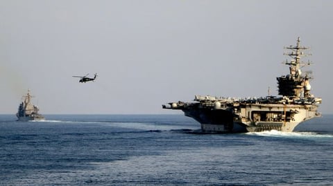 USS Dwight D. Eisenhower aircraft carrier crossing the Strait of Hormuz July 2026