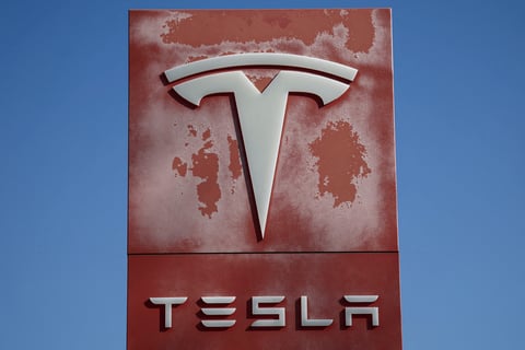 Tesla dealership logo as the company reports record Q2 2026 deliveries of 480000 vehicles and misses earnings estimates