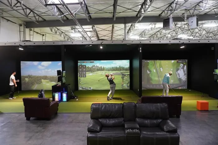 Left handed golfer hitting shots
