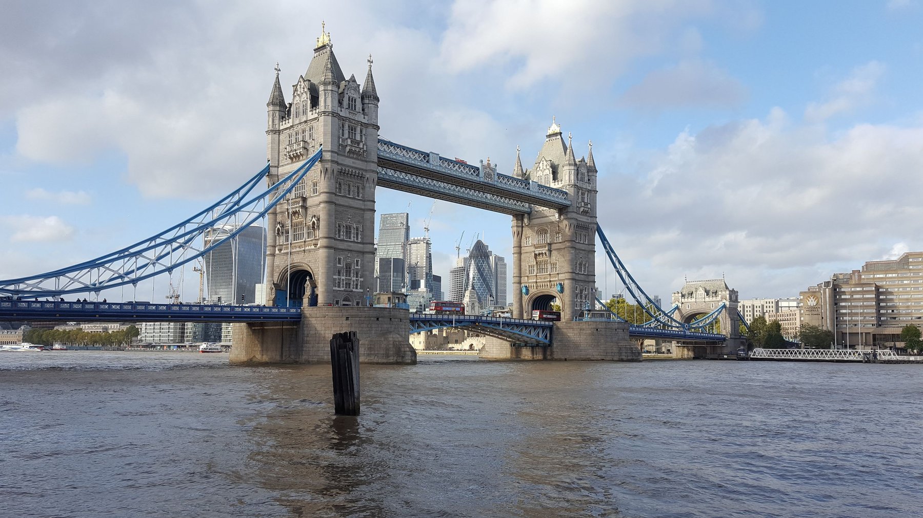 Busses cross the River Thames via Tower Bridge.