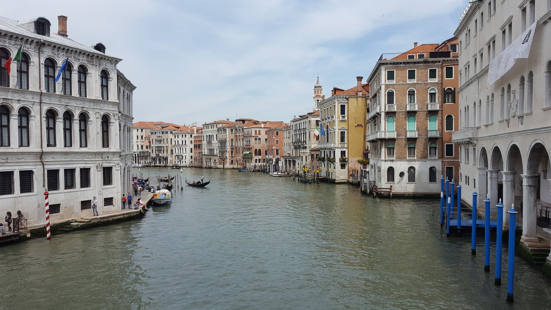 Buildings line the sides of a large canal.