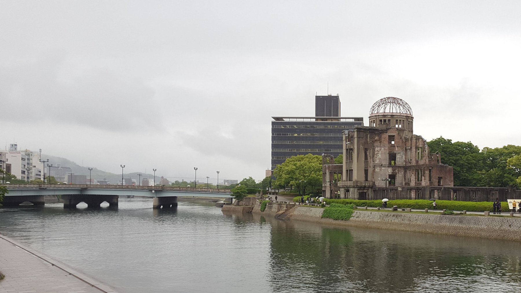 The ruins of a building with the majority of its structure intact. The metal frame of its dome is exposed, and the walls stripped bare to expose brickwork. All windows are missing and some walls are collapsed.