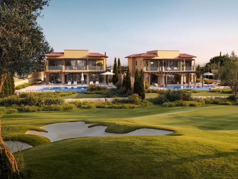 Luxury villas at Aphrodite Hills Tennis Gallery with views over a golf course, showcasing modern terraces and private pools.