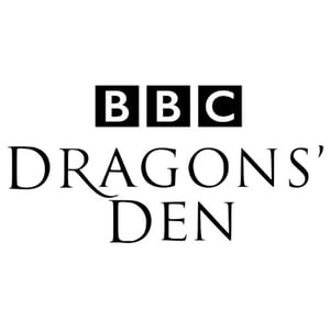 BBC Dragons' Den logo with bold black text and the BBC logo on a white background.