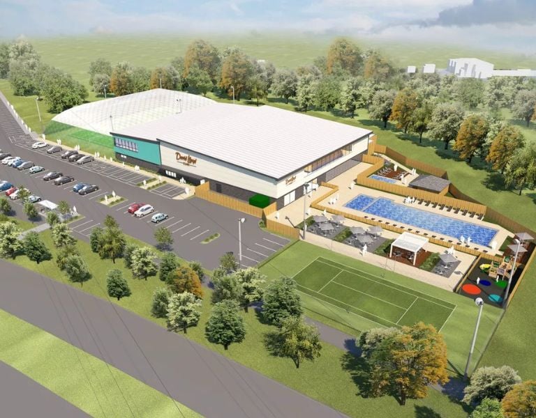 Render of DL Bristol leisure centre with indoor tennis court, outdoor pool, sun loungers, and parking surrounded by greenery.