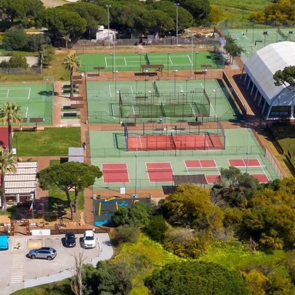 Aerial view of tennis courts and surroundings at Hilton Vilamoura As Cascatas Golf Resort & Spa in Portugal.