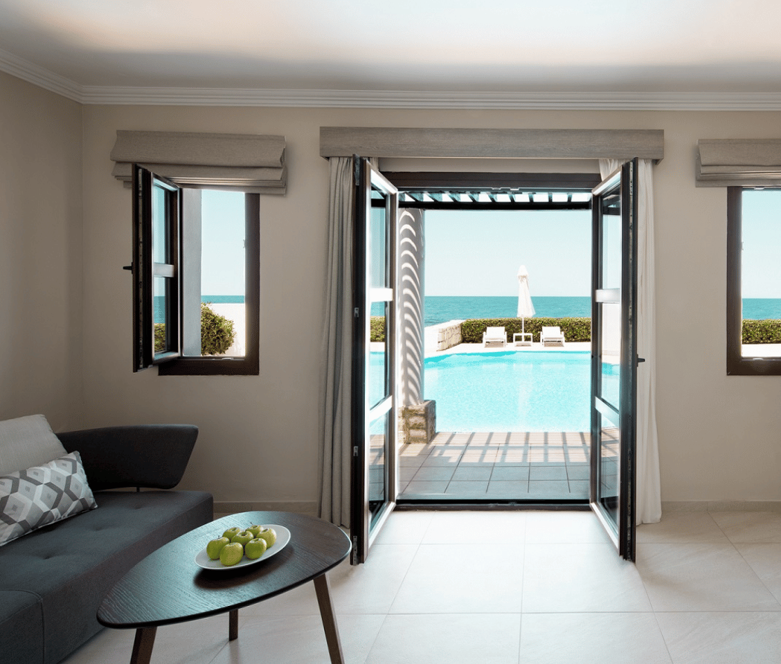 Royal Mare Junior Suite with private pool, sea view, and elegant interior furnishings.