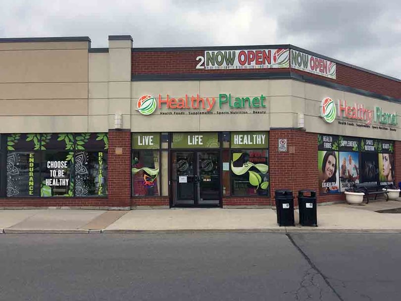Branded graphics across a commercial storefront in the GTA