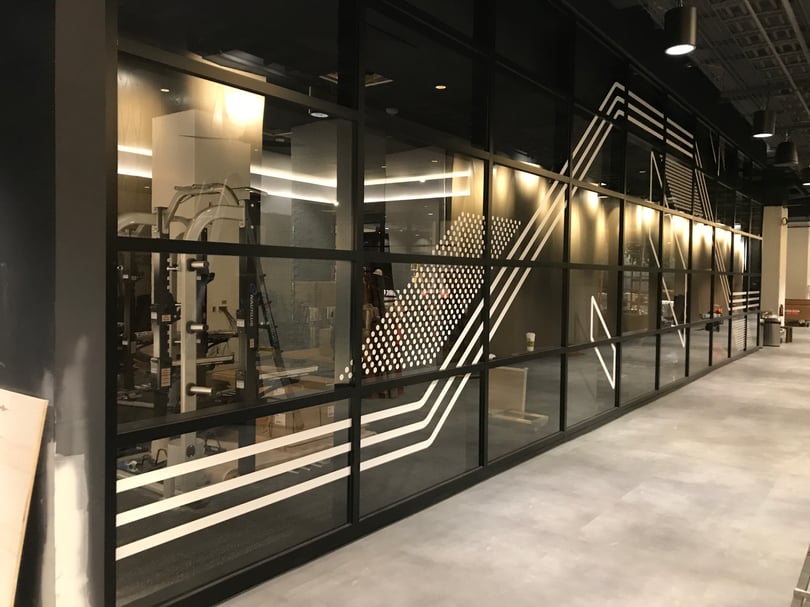 High-visibility window markings applied to commercial interiors