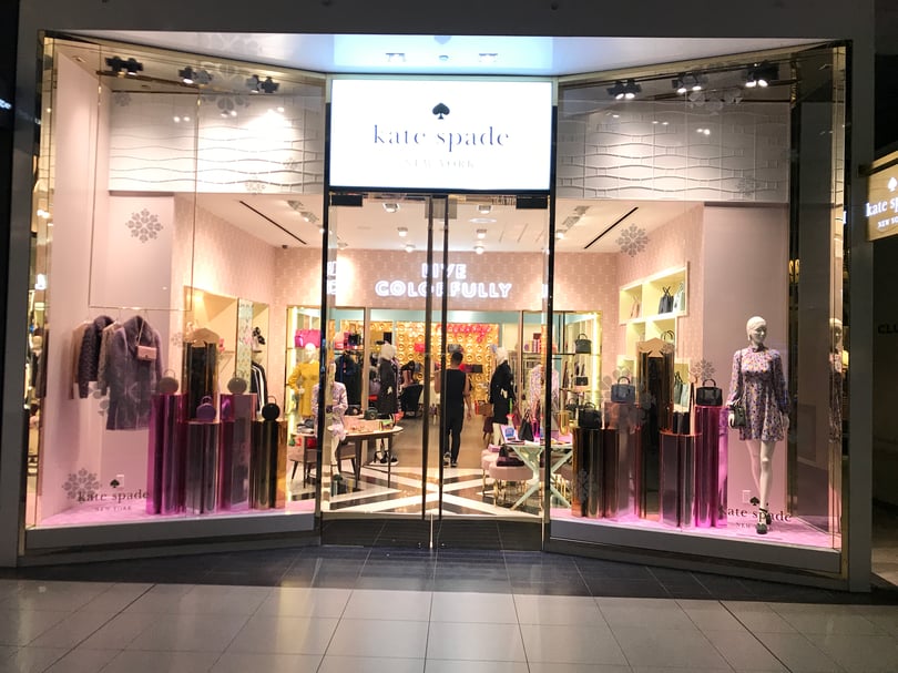 Retail store display window branding installation at Eaton Centre Toronto