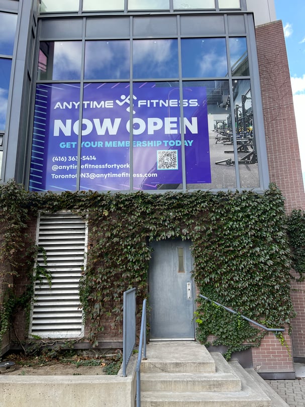Exterior window graphics using perforated film installed in Toronto